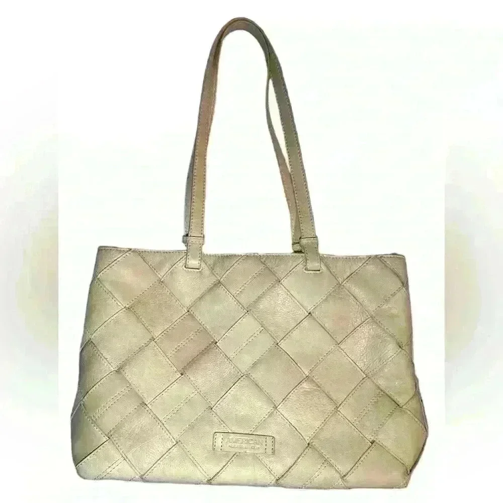 An American Leather Co. nude/cream colored leather woven tote bag.